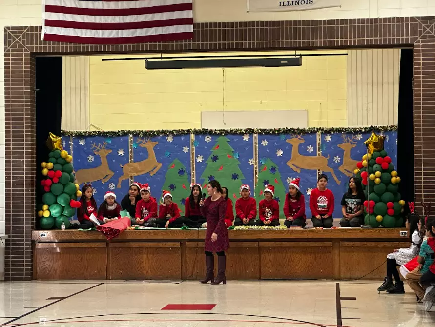 Ms. Garcia welcomes families to the event