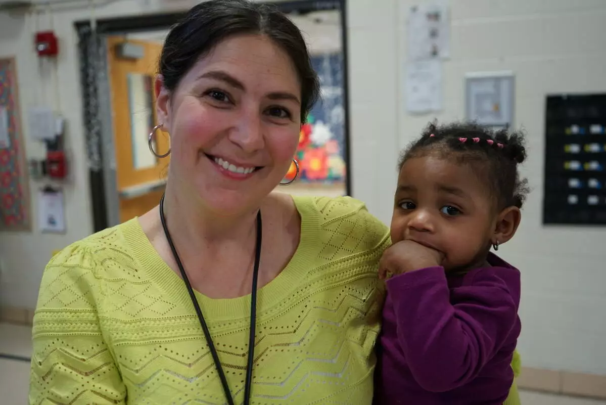 Mrs. Betz-Cahill enjoys time with one of our youngest family members