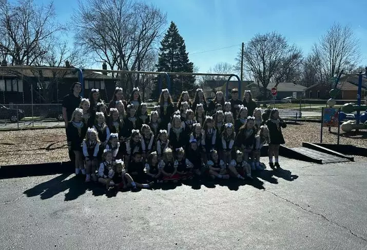 Trinity Irish Dancers pose for a picture outside of North School.