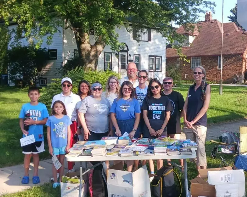North School staff are ready to welcome families and hand out free books for summer reading!