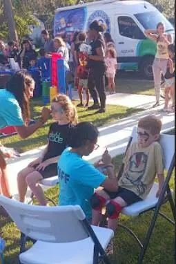 YMCA volunteers face paint