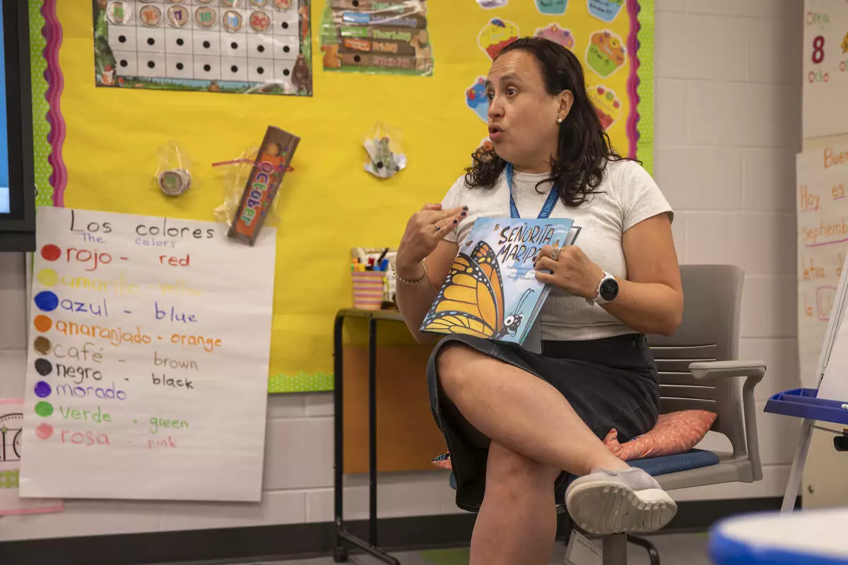 Ms. Serrano speaks to the families in her session about butterflies.