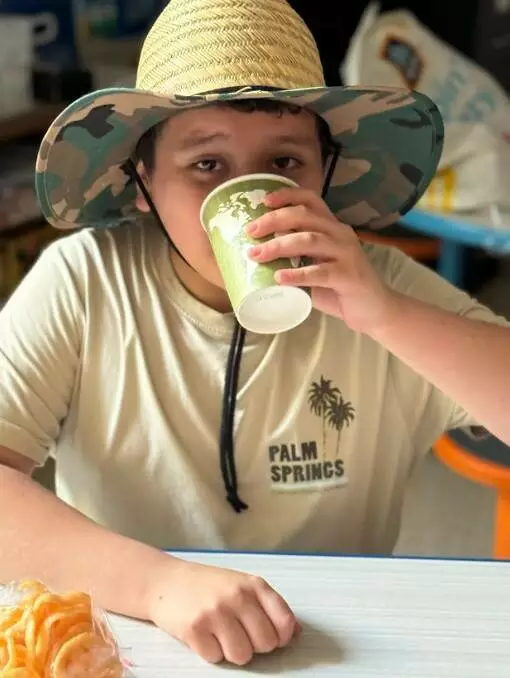 A student enjoys a delicious glass of horchata. 