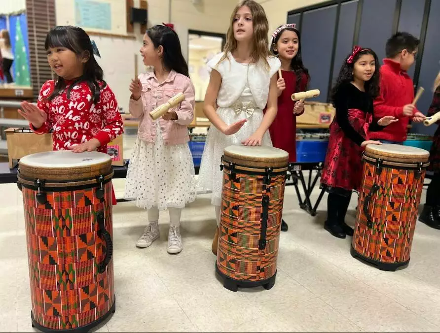 Children performed on tubano drums.