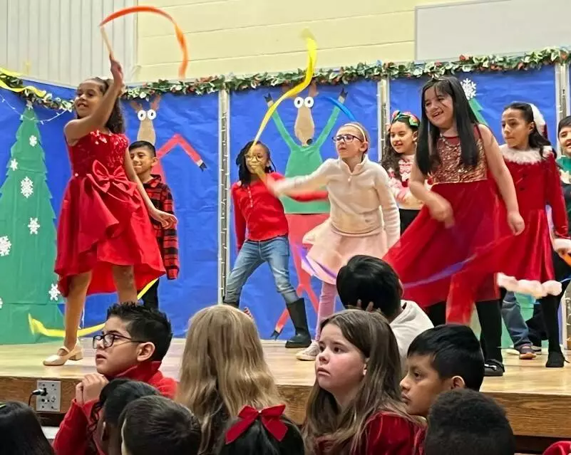 Students show off their talents by dancing with festive ribbons.