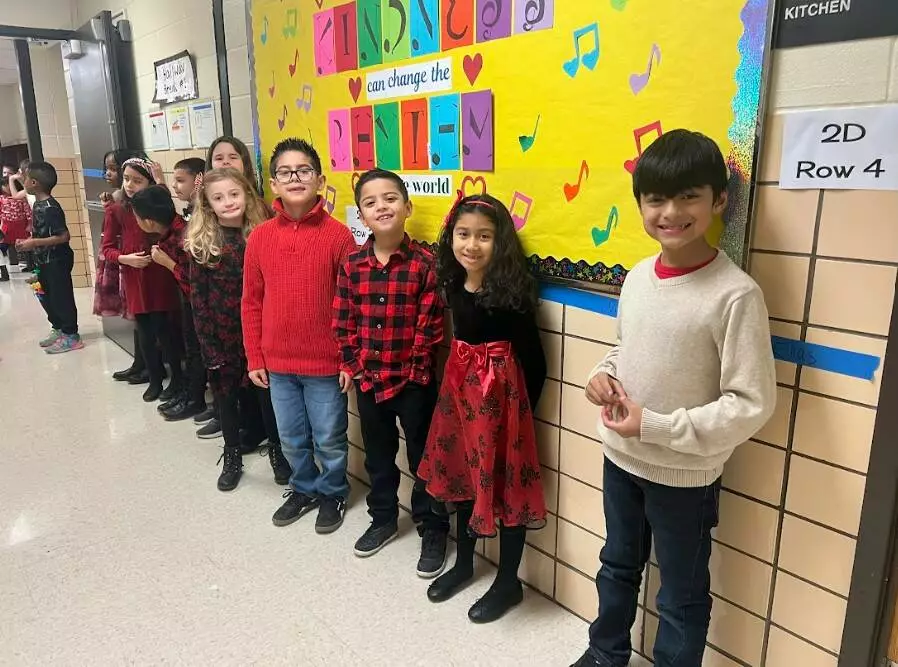 2nd Graders excitedly prepare to perform for their families.