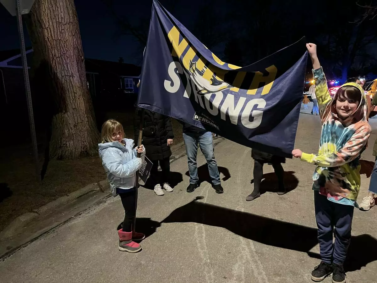 Students wave the North Strong flag with pride