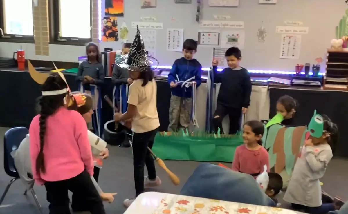 Students excitedly perform their play for others. 