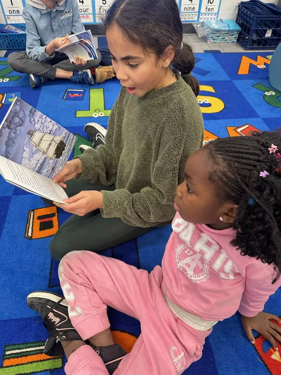 Readers get cozy on the carpet. 
