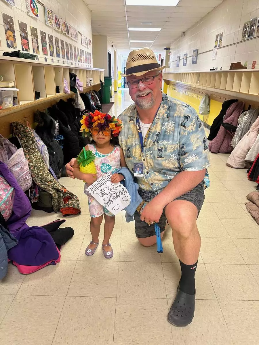 Mr. Leinweber and a first grader were soaking up the sun!